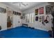 Home gym with workout equipment, mirrors, and plenty of natural light from the large window at 4830 Byzantine Ct, Las Vegas, NV 89149