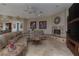 Bright and airy living room showcases plush seating, a fireplace, built-in shelving, and ample space for entertaining at 4830 Byzantine Ct, Las Vegas, NV 89149