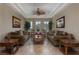 Cozy living room featuring a coffered ceiling, plantation shutters, and comfortable furnishings at , Las Vegas, NV 89149