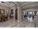 Open-concept living space showcasing travertine flooring, elegant pillars, and seamless flow at 4830 Byzantine Ct, Las Vegas, NV 89149