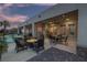 Inviting outdoor patio featuring multiple seating areas with a pool view during a serene twilight hour at , Las Vegas, NV 89149