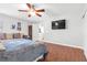 Bright bedroom featuring a ceiling fan, a queen size bed, and a ceiling fan at 11004 Dornoch Castle St, Las Vegas, NV 89141