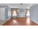 Living room with a decorative fireplace and light gray walls and hardwood floors at 1301 E St Louis Ave # C, Las Vegas, NV 89104