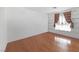 Open living room with hardwood floors, built-in shelves and lots of natural light at 1301 E St Louis Ave # C, Las Vegas, NV 89104
