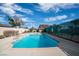 Community pool with crystal-clear water, surrounded by well-maintained landscaping and fencing for privacy at 1301 E St Louis Ave # C, Las Vegas, NV 89104