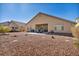 The open backyard with a covered patio offers opportunities for outdoor activities and leisure at 1484 Midnight Cowboy Ct, Las Vegas, NV 89110