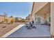 Spacious backyard featuring a covered patio and a large gravel area, perfect for relaxing at 1484 Midnight Cowboy Ct, Las Vegas, NV 89110