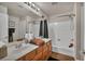 Bathroom with a double sink vanity and shower-tub combination at 1484 Midnight Cowboy Ct, Las Vegas, NV 89110