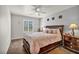 Comfortable bedroom with neutral walls, carpet flooring, and a ceiling fan at 1484 Midnight Cowboy Ct, Las Vegas, NV 89110