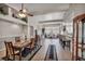 Spacious dining room showcases a large wooden table, tiled floors, and an open-concept design at 1484 Midnight Cowboy Ct, Las Vegas, NV 89110