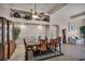 Elegant dining room with a wooden table, stylish chairs, and decorative accents at 1484 Midnight Cowboy Ct, Las Vegas, NV 89110