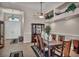 Well-lit dining area features a classic table and chairs set, complemented by tasteful décor at 1484 Midnight Cowboy Ct, Las Vegas, NV 89110