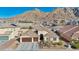 Lovely single-story home boasts a three-car garage and desert landscaping at 1484 Midnight Cowboy Ct, Las Vegas, NV 89110