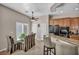 An expansive view of the eat-in kitchen area with matching table and chairs and the kitchen island in the background at 1484 Midnight Cowboy Ct, Las Vegas, NV 89110