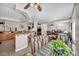 A large and expansive living and dining area with views to the kitchen and out to the backyard at 1484 Midnight Cowboy Ct, Las Vegas, NV 89110