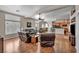 Open living room layout with hardwood floors flowing into the kitchen and dining areas at 1484 Midnight Cowboy Ct, Las Vegas, NV 89110