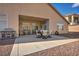 Covered patio with dining set, chairs, and barbecue grill, perfect for outdoor entertaining at 1484 Midnight Cowboy Ct, Las Vegas, NV 89110