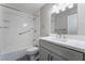 Bathroom features a shower-tub combo, single sink vanity, and updated fixtures at 220 Mission Catalina Ln # 202, Las Vegas, NV 89107