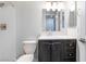 Bathroom with a shower, dark vanity, and neutral countertops at 220 Mission Catalina Ln # 202, Las Vegas, NV 89107