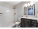 Bathroom with a shower, dark vanity, and neutral countertops at 220 Mission Catalina Ln # 202, Las Vegas, NV 89107