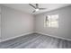 This bedroom features durable, light-colored floors, a ceiling fan, and a window at 220 Mission Catalina Ln # 202, Las Vegas, NV 89107