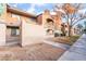 Exterior shot of a well-maintained building with orange stucco and nice landscaping at 220 Mission Catalina Ln # 202, Las Vegas, NV 89107