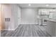 Open floor plan featuring modern kitchen, wood-look laminate flooring at 220 Mission Catalina Ln # 202, Las Vegas, NV 89107