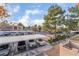 Parking lot with covered parking spaces and landscaped greenery at 220 Mission Catalina Ln # 202, Las Vegas, NV 89107