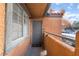 Front door to condo with a neutral tone and covered porch area at 220 Mission Catalina Ln # 202, Las Vegas, NV 89107