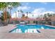 Sparkling community pool with well-kept fences and lounge areas at 220 Mission Catalina Ln # 202, Las Vegas, NV 89107