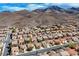 Panoramic aerial view of a desert residential community nestled against mountain views at 2210 Shadow Canyon Dr, Henderson, NV 89044