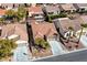 Aerial view of a well-manicured neighborhood with tree-lined streets and desert landscaping at 2210 Shadow Canyon Dr, Henderson, NV 89044
