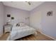 This is a bright bedroom with a large closet and wood-look floors at 2210 Shadow Canyon Dr, Henderson, NV 89044