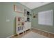 This bedroom features wood-look floors and two white storage cabinets at 2210 Shadow Canyon Dr, Henderson, NV 89044