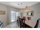 Bright dining area featuring modern lighting and outdoor views, adjacent to patio at 2210 Shadow Canyon Dr, Henderson, NV 89044