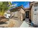Beautiful single-story home featuring stone accents, desert landscaping, and a welcoming walkway at 2210 Shadow Canyon Dr, Henderson, NV 89044
