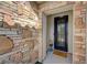 Charming home entrance featuring a decorative door and stone wall at 2210 Shadow Canyon Dr, Henderson, NV 89044