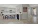 Stylish kitchen with a breakfast bar, wine fridge, stainless steel appliances, and pendant lighting at 2210 Shadow Canyon Dr, Henderson, NV 89044