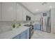 Contemporary kitchen with stainless steel appliances and sleek marble countertops at 2210 Shadow Canyon Dr, Henderson, NV 89044
