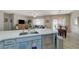 Spacious kitchen with stainless steel appliances, a large island, and an adjacent dining area with natural light at 2210 Shadow Canyon Dr, Henderson, NV 89044