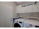 This spacious laundry room has ample cabinet and shelf storage at 2210 Shadow Canyon Dr, Henderson, NV 89044