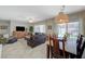 Cozy living room and dining area with access to outdoor space, perfect for relaxing and entertaining at 2210 Shadow Canyon Dr, Henderson, NV 89044