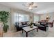Comfortable living area with hardwood flooring, a large window, and a view into dining area at 2210 Shadow Canyon Dr, Henderson, NV 89044