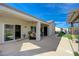 The covered patio features comfortable seating, lush landscaping, and plenty of space for relaxing and entertaining at 2210 Shadow Canyon Dr, Henderson, NV 89044