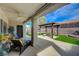 Inviting covered patio featuring a pergola, manicured lawn and plenty of space for outdoor entertaining and relaxation at 2210 Shadow Canyon Dr, Henderson, NV 89044