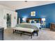 Spacious main bedroom boasts a blue accent wall and closet at 229 Drysdale Cir, Henderson, NV 89074