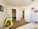 bedroom featuring carpeted floors, a closet, and a view of the en-suite bathroom at 2412 Twin Flower Cir, Las Vegas, NV 89134