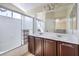 Bright bathroom featuring a double sink vanity and shower-over-tub at 2865 Vigilante Ct, North Las Vegas, NV 89081