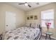 Cozy bedroom with modern decor, comfortable bed, and natural light at 2865 Vigilante Ct, North Las Vegas, NV 89081