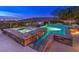 Backyard oasis boasting a pool with spa and waterfall, offering a serene setting with scenic views at 30 Dry Brook Trl, Henderson, NV 89052